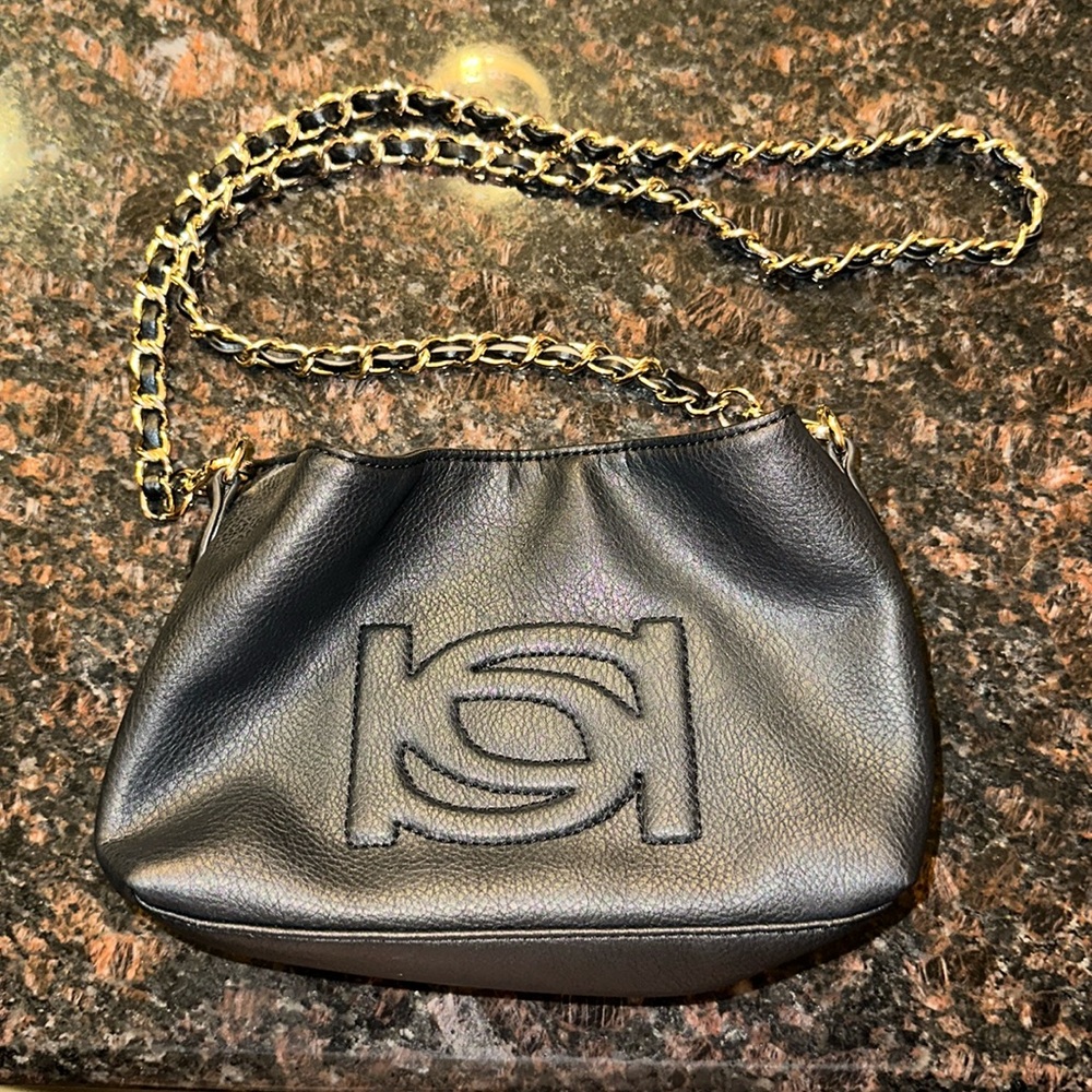 Bebe small black purse w gold chain.